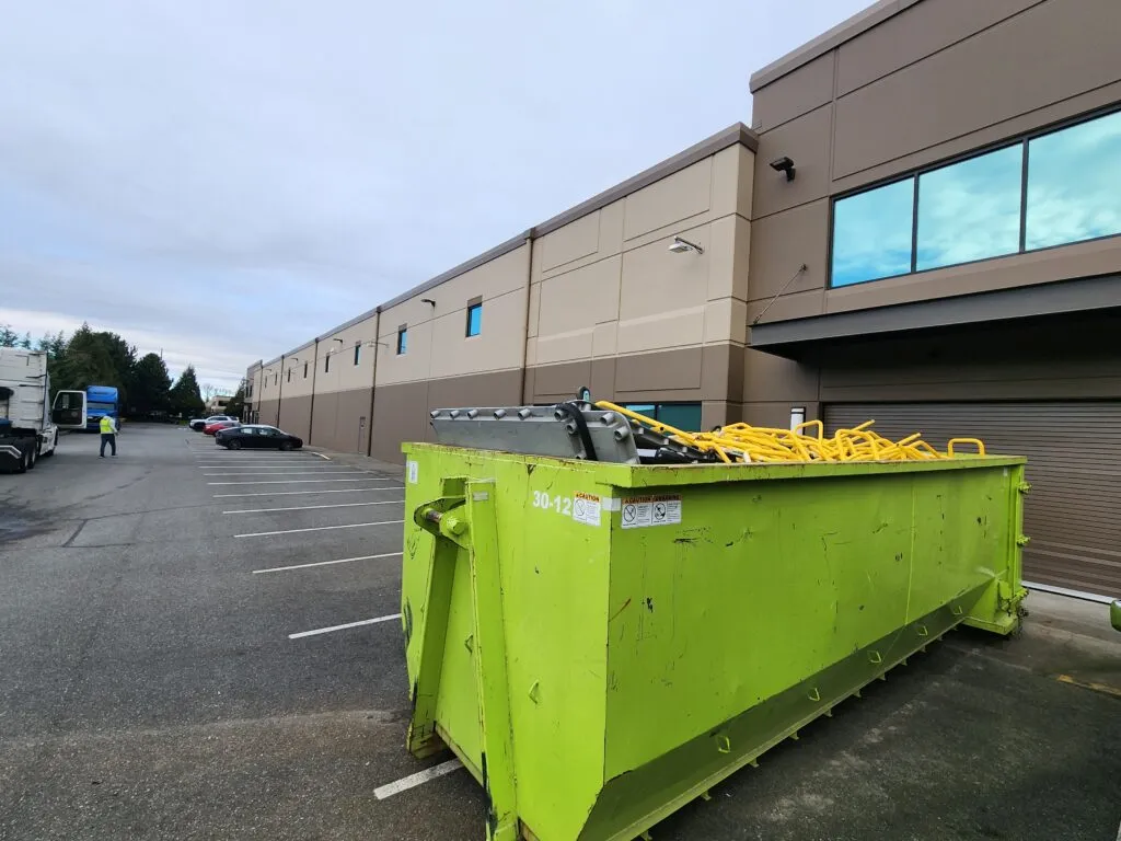 Rainier Dumpster Rental 30-yard commercial roll-off bin delivered to an industrial job site in Renton, WA.
